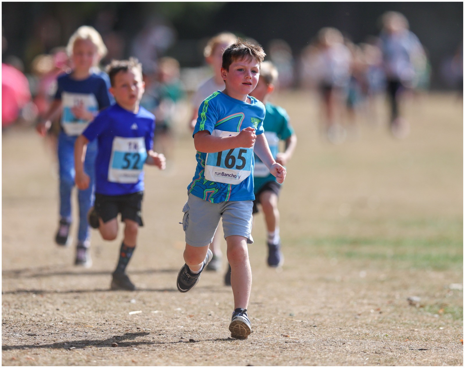 Young runners racing on the park loop at Banchory